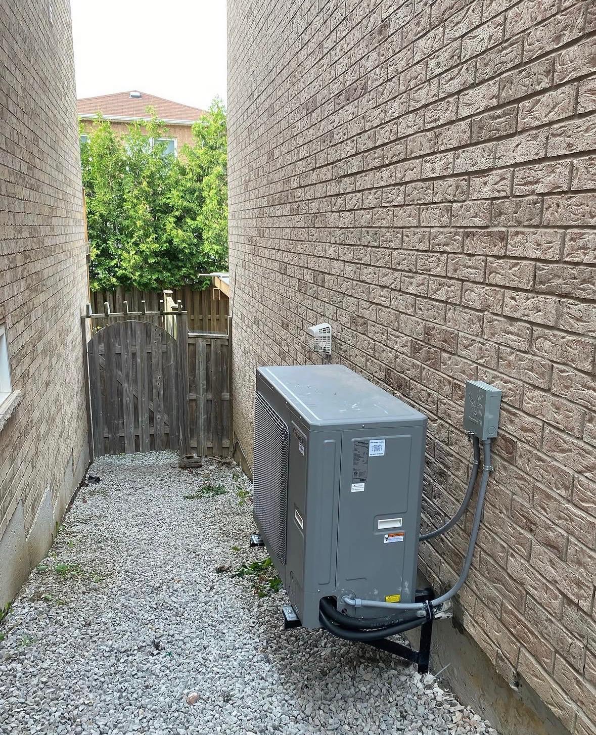 Energy-efficient central air conditioner installed at a home